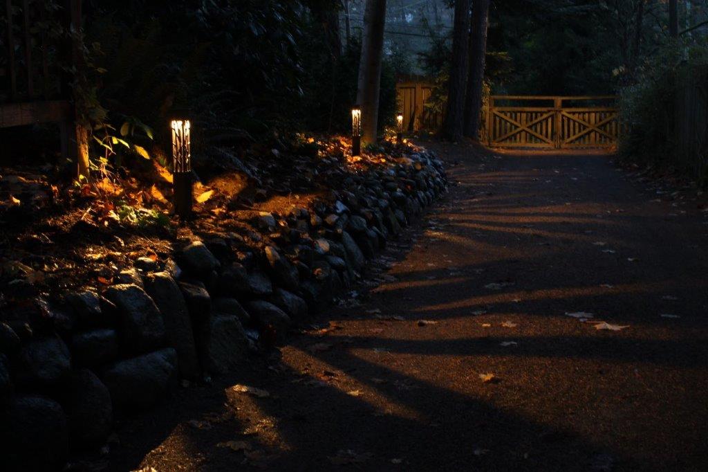 gravel driveway lit at night